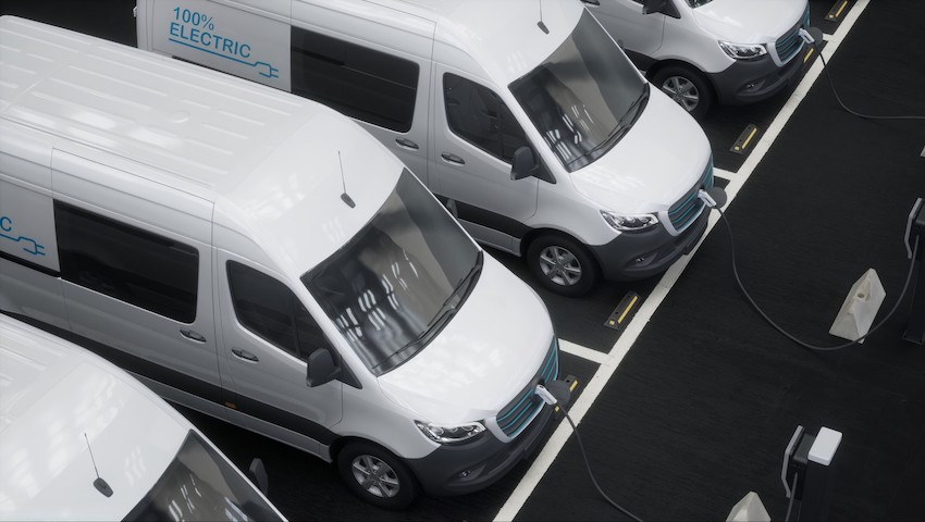 Row of electric vans charging